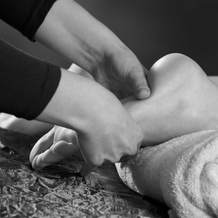 foot massage during lymphatic drainage treatment