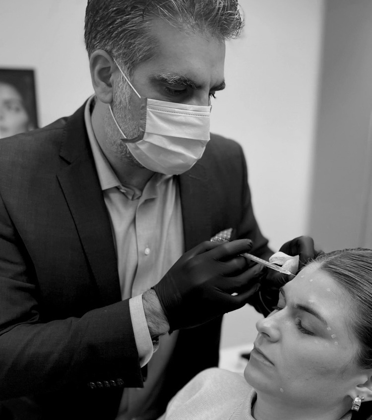 Photo of Dr. Fazilat giving a patient a Botox treatment